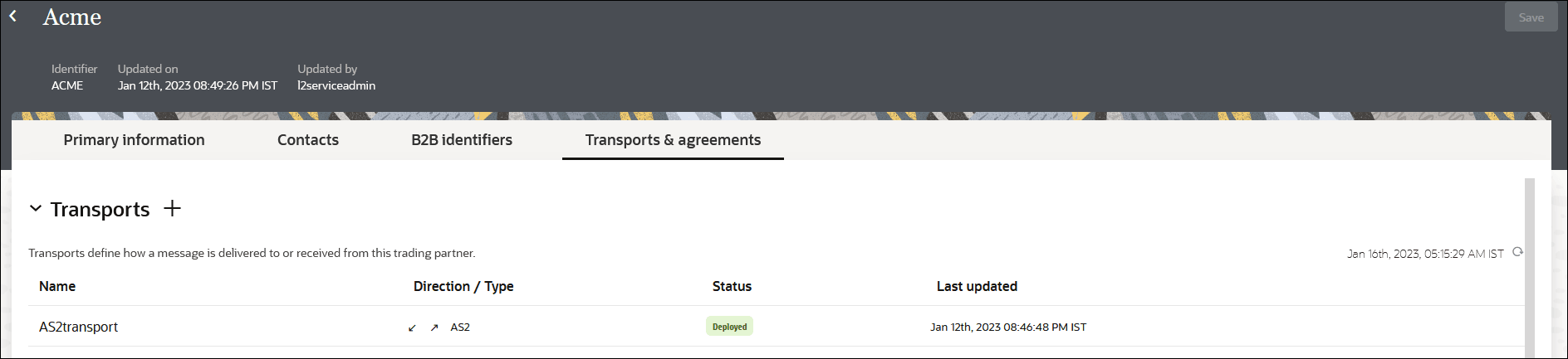 The Primary Information, Contacts, B2B Identifiers, and Transports & Agreements (which is selected) are shown. Below is the Transports section, with a + sign. Below is a table with columns for Name, Direction/Type, Status, and Last Updated.