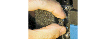 Image showing tightening the Thumbscrews to Secure the Chassis to the Rack